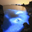 Blue flashes paint sea as starry night