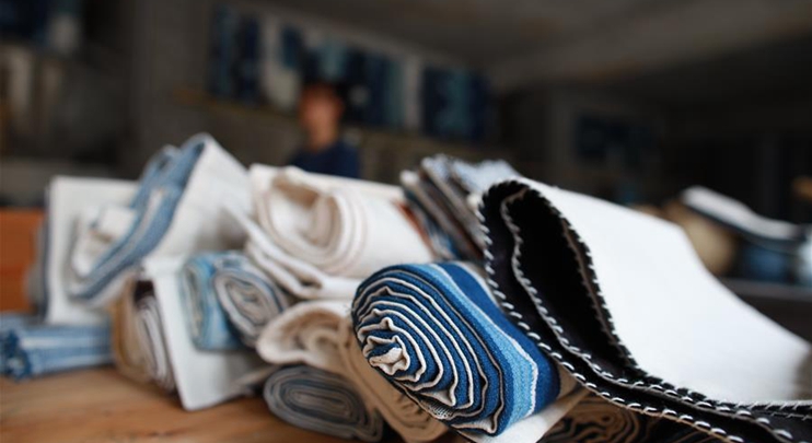 Locals make traditional cloth of Dong ethnic group in Guizhou