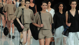Models present accessories by designers at China Fashion Week